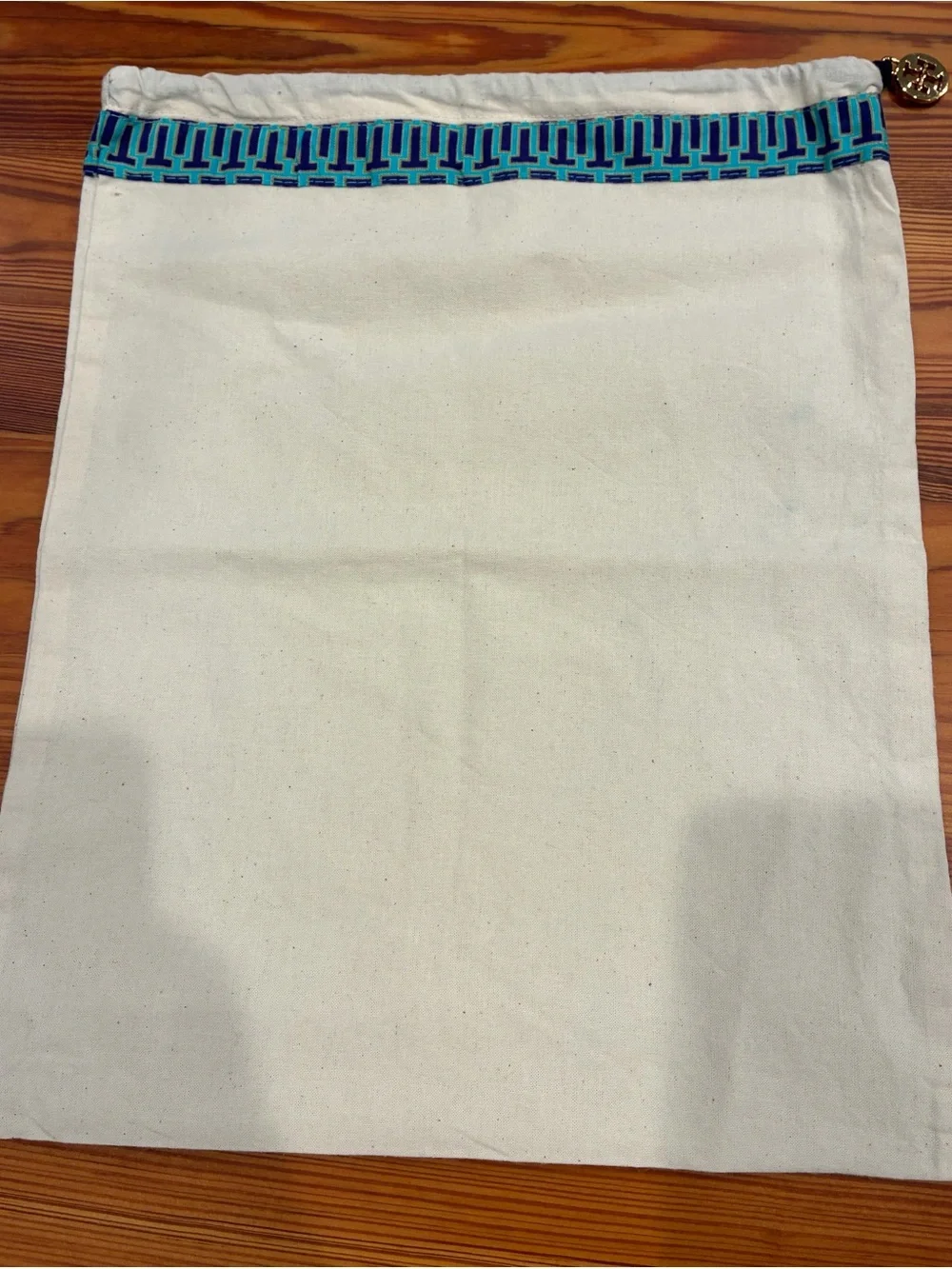 Tory Burch Cream Dust Bag with Navy and Teal Trim & Gold Logo Charm